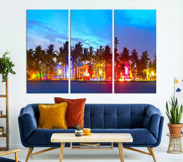 The living room features a three-panel Miami City Wall Art Canvas Print, showcasing a colorful, illuminated beach scene with palm trees on museum-quality canvas.