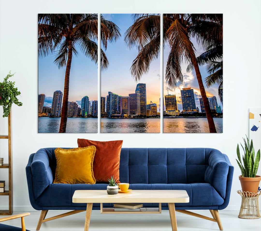 The Wall Art MIAMI Canvas Print features a triptych design depicting palm trees and a city skyline at sunset.