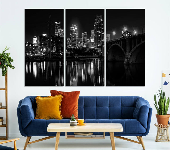 The "Minneapolis Wall Art Canvas Print, Minnesota City Wall Art Print, Minnesota Cityscapes Wall Art" features a black and white triptych of a city skyline with a bridge. Crafted on museum-quality canvas, this gallery-wrapped artwork is finished with a UV-protective coating to ensure lasting beauty.