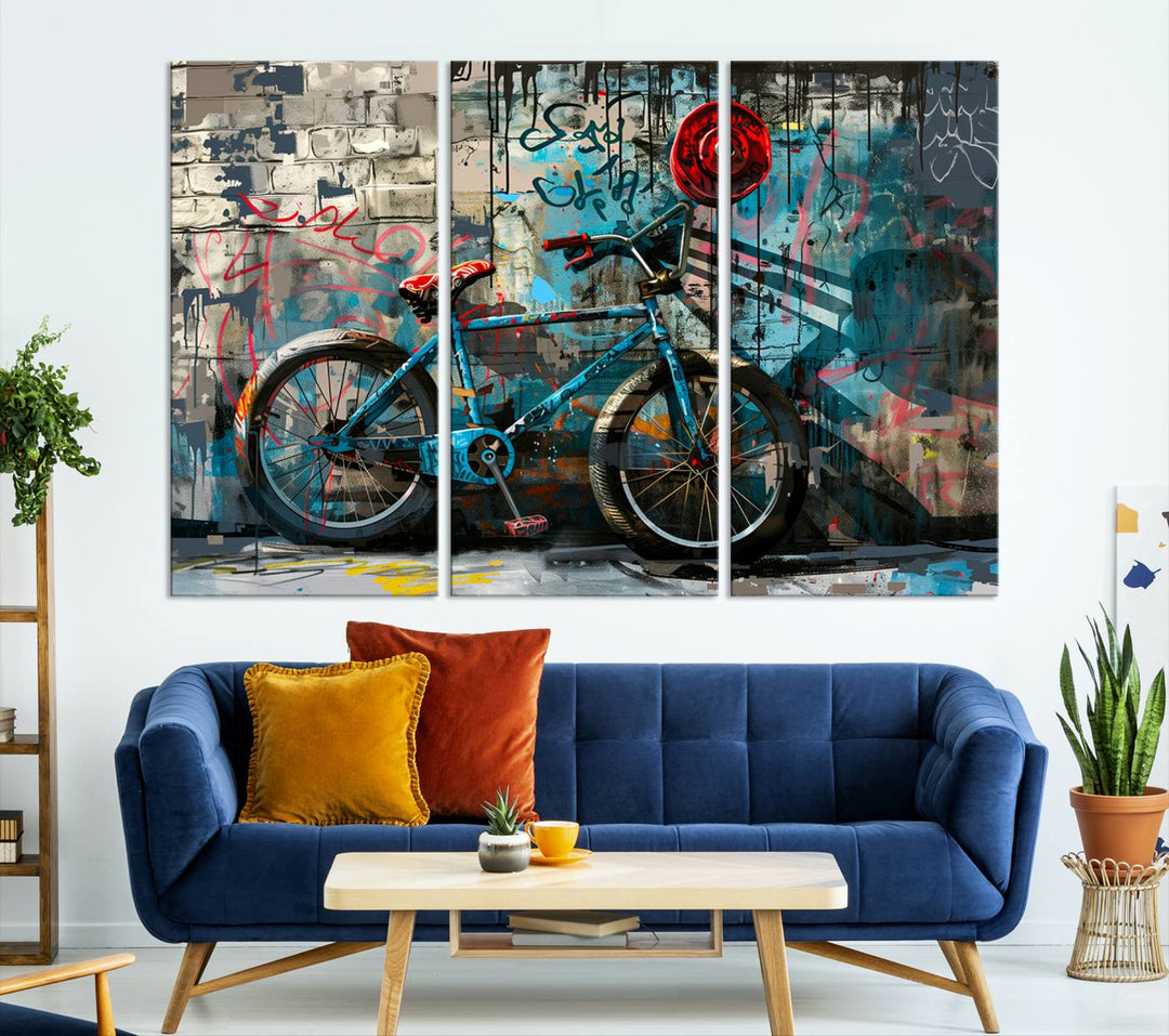 A modern living room features a triptych wall art of an abstract bicycle, designed in a graffiti style on a brick wall. This piece is expertly crafted on the Abstract Bicycle Wall Art Canvas Print, offering a premium canvas that ensures a gallery-quality finish.