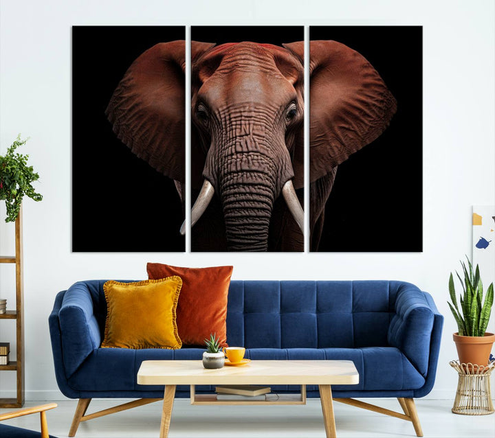 A stunning triptych titled "Wild Elephant Wall Art Canvas Print" beautifully enhances the wall above a contemporary living room. This Africa Savannah Wild Animal Wall Decor Print is of museum-quality, complete with a UV-protective coating to ensure its vibrancy and beauty are preserved for years.