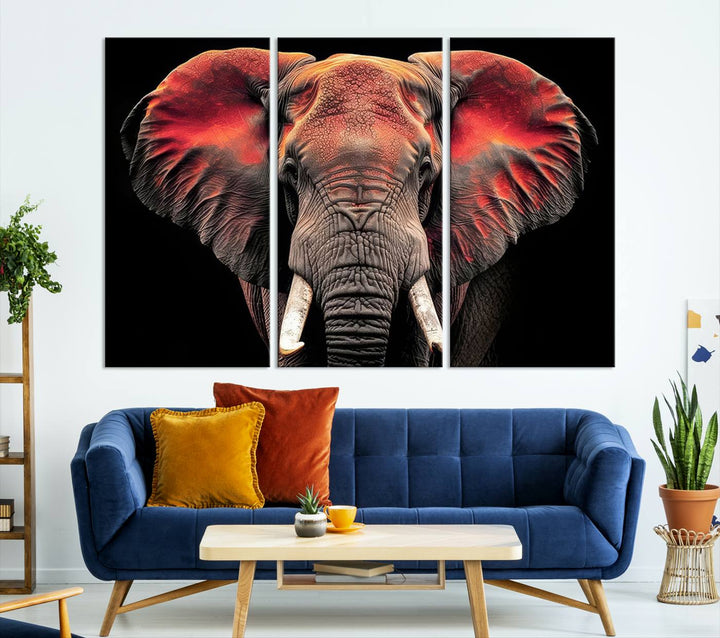 The Elephant Wall Art Canvas Print, featuring vibrant red and black tones, is a stunning artwork printed on museum-quality canvas. It comes with a UV-protective coating.