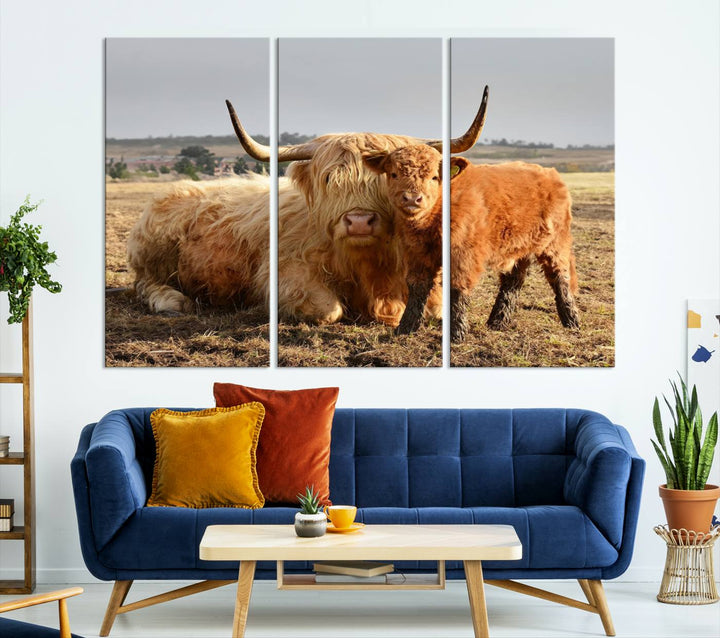 The three-panel canvas artwork, titled "Highland Cow Canvas Wall Art Animal Print for Farm House Decor," features a serene scene of a resting Highland cow and calf in a field. The piece highlights its gallery-quality finish.