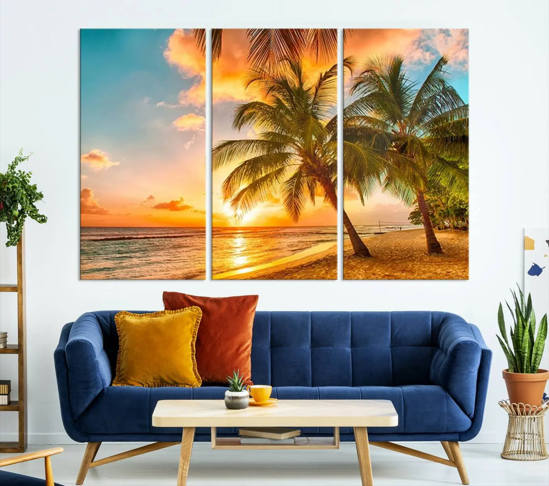 The Tropical Sunset Wall Art Print features a vibrant beach scene with palm trees and an ocean view highlighted by a golden sunset.