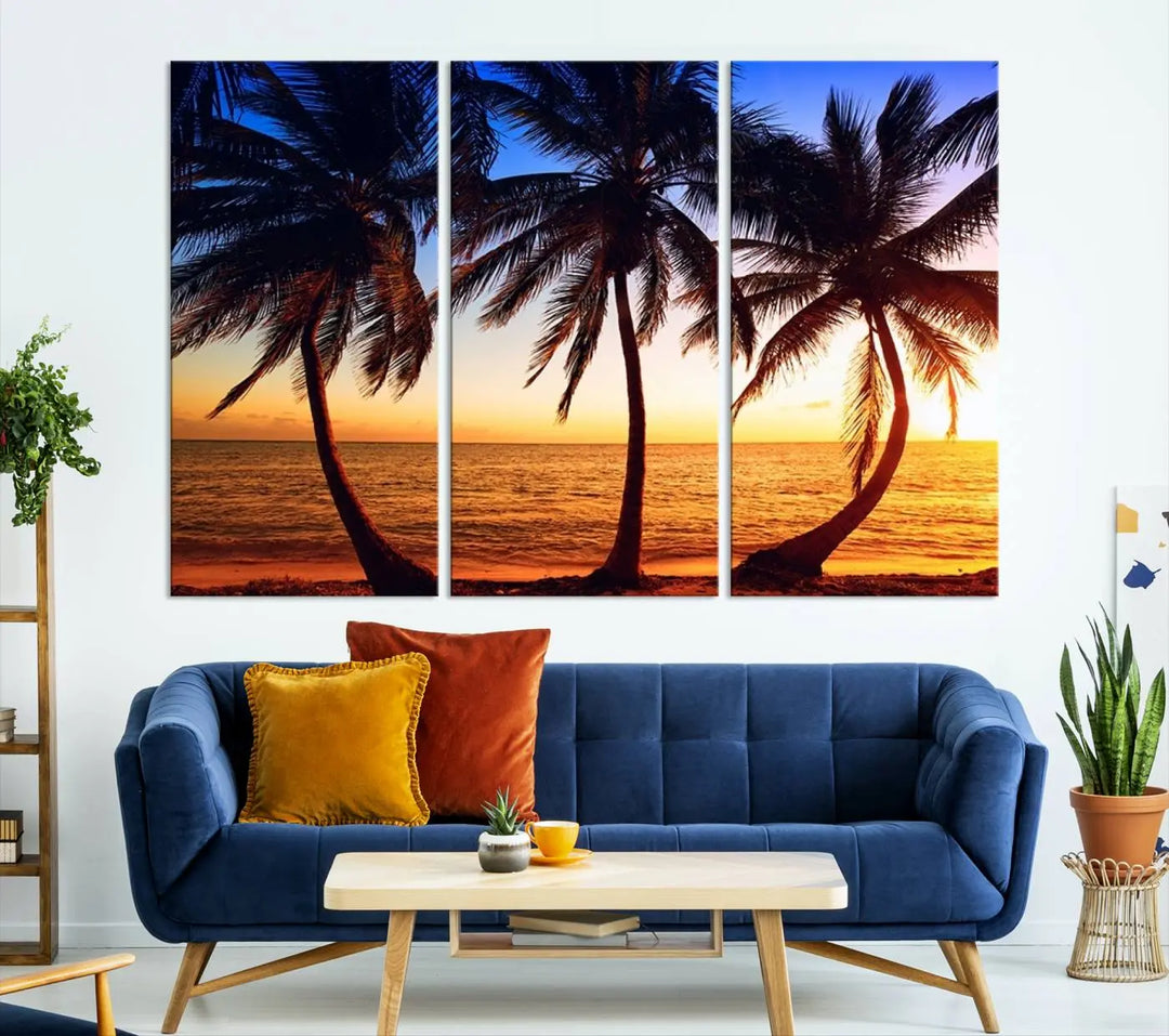 The living room features a wall adorned with the "Wall Art Canvas Curve Palms at Sunset on Beach," showcasing gallery-wrapped, museum-quality canvases in a stunning triptych.