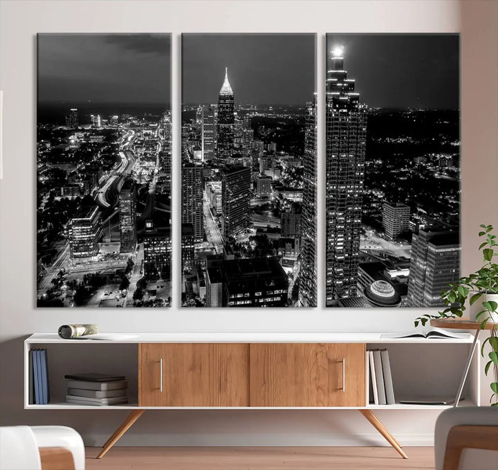 The Atlanta City Lights Skyline Black and White Wall Art Cityscape Canvas Print is elegantly displayed on the wall. These museum-quality canvases arrive ready to hang, making your art display both effortless and sophisticated.