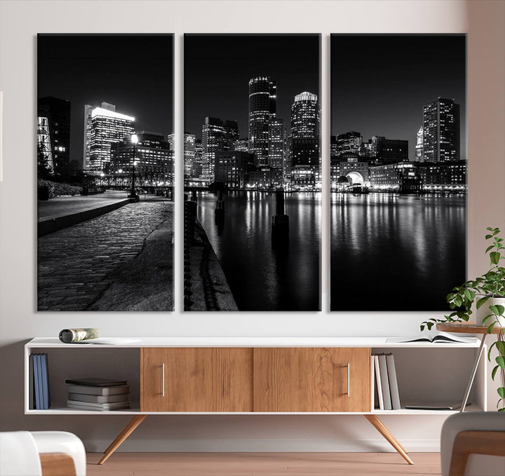 The Boston Lights Skyline Black and White Wall Art Cityscape Canvas Print, crafted with museum-quality canvas and UV-protective coating, serves as a striking triptych centerpiece in the living room.