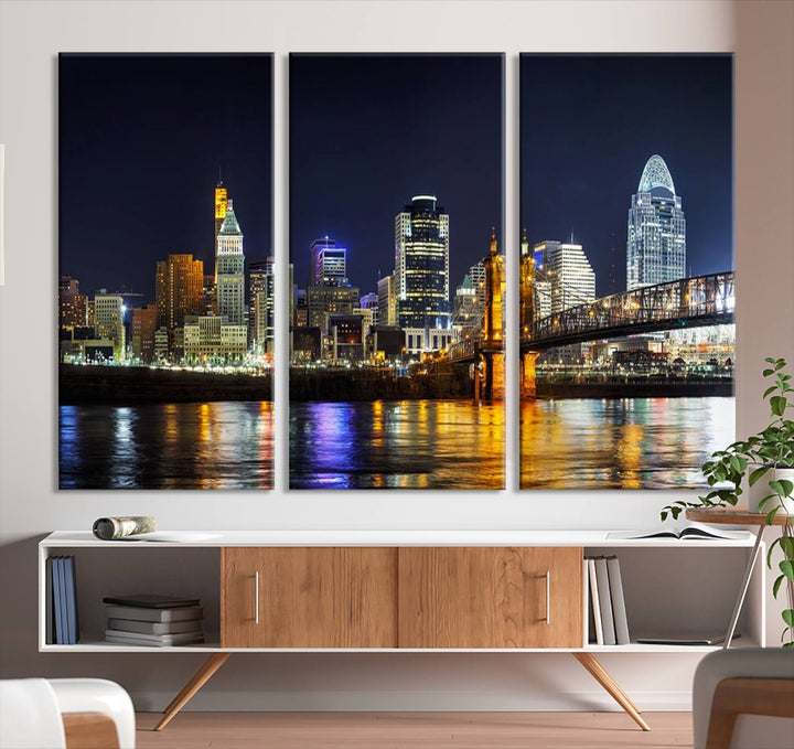 The Cincinnati City Lights Night Skyline Cityscape View Wall Art Canvas Print, crafted on museum-quality canvas with UV-protective coating and ready to hang, adds a touch of sophistication to the wall.