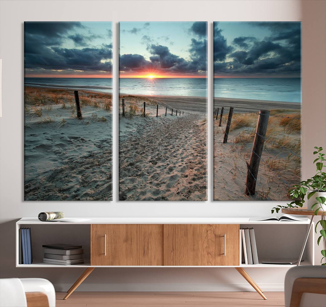 The modern living room features the Cloudy Weather Sunset Beach Wall Art Canvas Print. This museum-quality canvas adds a touch of sophistication with its hand-assembled framed art, ensuring lasting elegance. Enjoy free shipping on this exquisite piece.