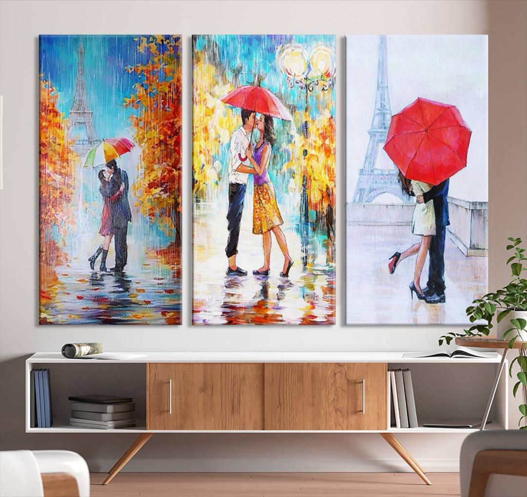 A triptych of the "Love in Paris Wall Art Canvas Print" showcases a couple with an umbrella in romantic settings. This artwork is crafted on museum-quality canvas and features a UV-protective coating for peace of mind. It also comes with the added convenience of free shipping.