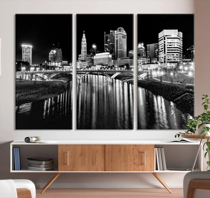 The living room showcases the Columbus City Lights Skyline Black and White Wall Art Cityscape Canvas Print.