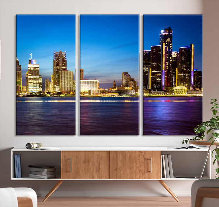 The living room features a breathtaking canvas print titled "Detroit City Lights Night Bright Blue Skyline Cityscape View," presented in a stunning triptych format on museum-quality canvases that are ready to hang.