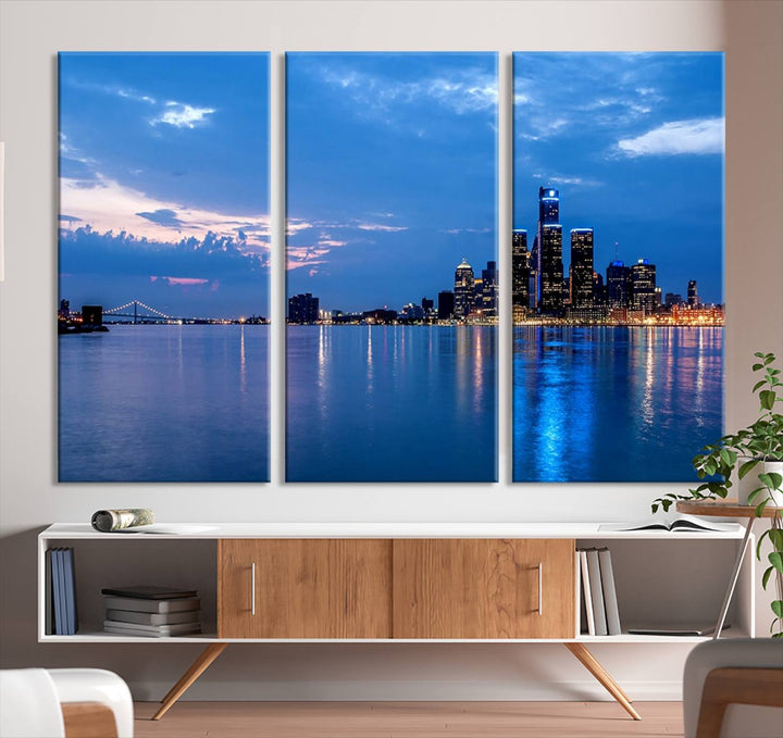 The "Detroit City Lights Night Blue Cloudy Skyline Cityscape View" wall art, displayed on museum-quality canvases, is split into three gallery-wrapped panels.