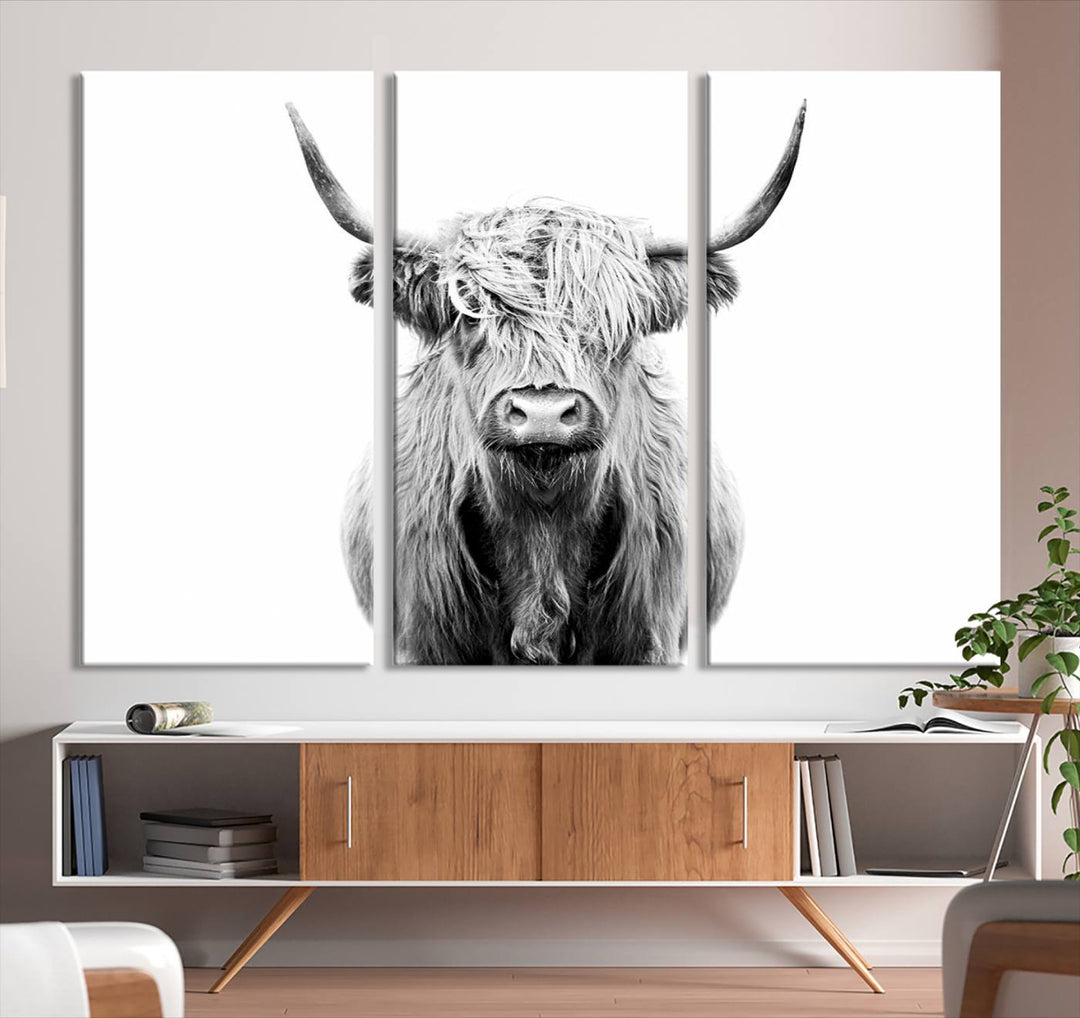 The wall art features a triptych of a Scottish Highland cow, printed on museum-quality canvases with a UV-protective coating. This decorative piece is known as the Highland Cow Canvas Wall Art Farm House Wall Art.