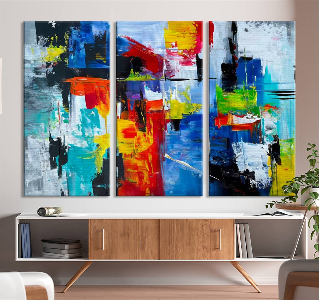 Three Colorful Abstract Wall Art Canvas Prints feature vibrant colors on museum-quality canvas and are finished with a UV-protective coating. Their ready-to-hang design allows for effortless transformation of your space.