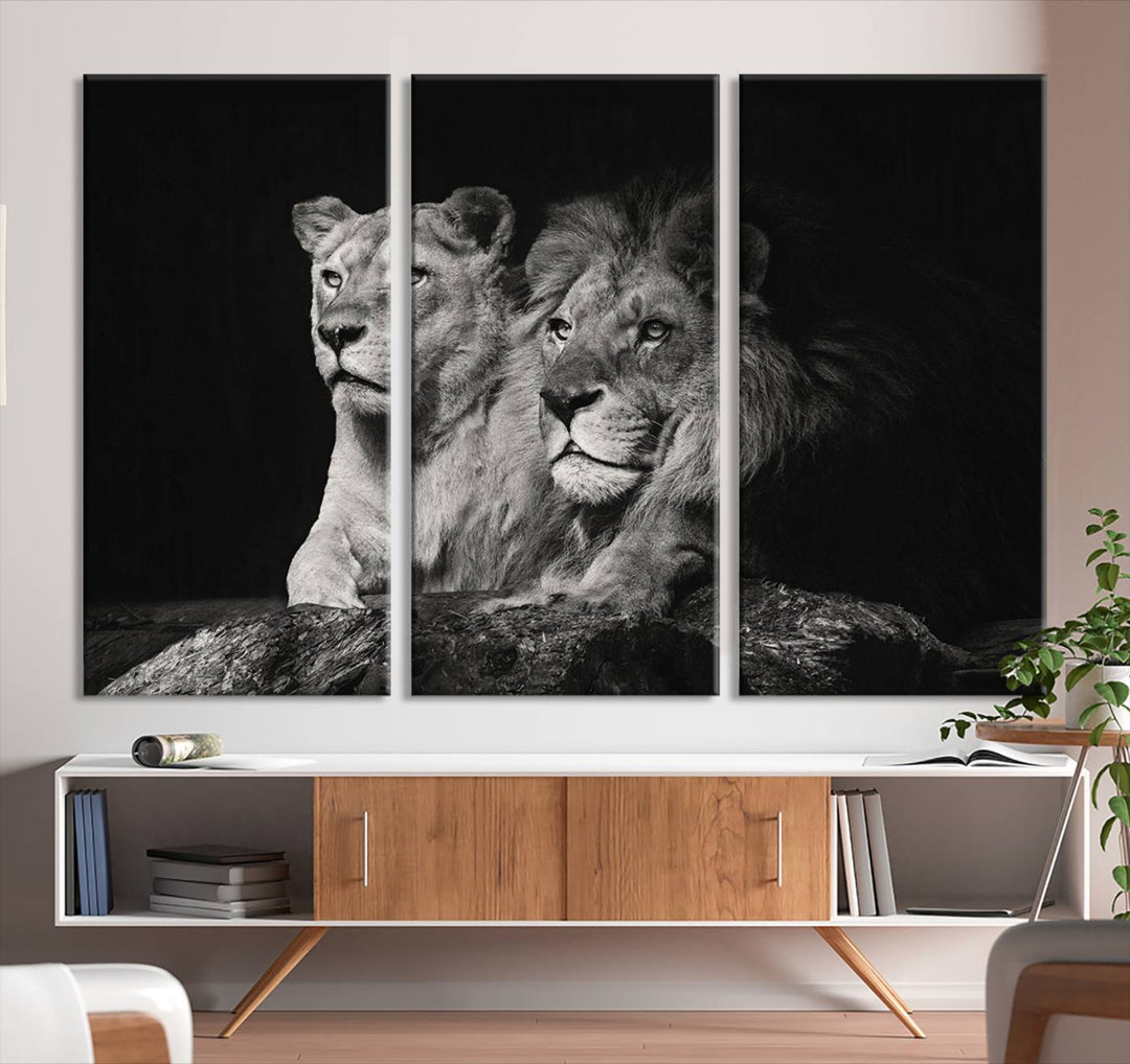 The elegant wildlife portrait, "Lion Couple Canvas Wall Art Print," featuring a black and white depiction of a lion family, majestically decorates the living room wall.