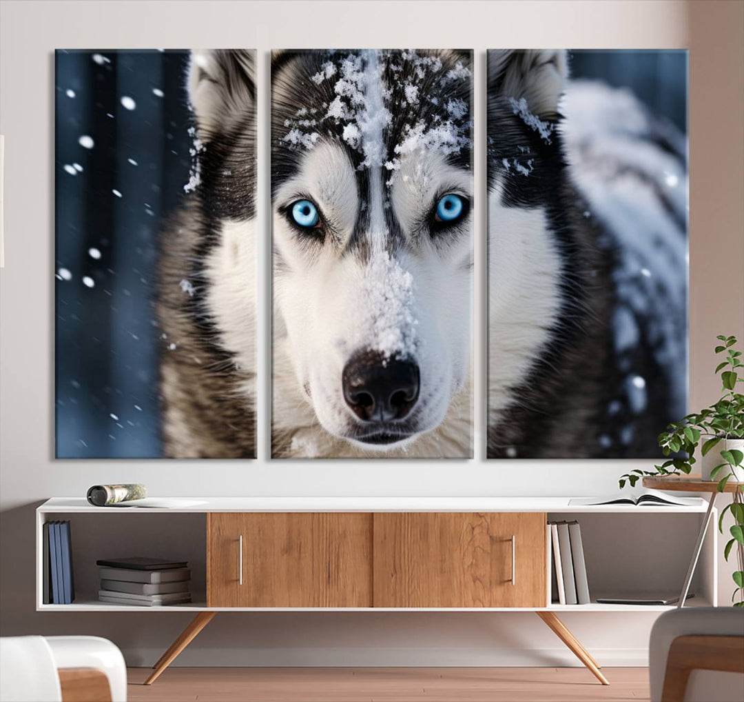 A digital art piece titled "Winter Siberian Husky Wolf Wall Art Canvas Print" showcases a blue-eyed husky blanketed in snow. Printed on high-quality canvas, it is an ideal choice for nature and dog enthusiasts.