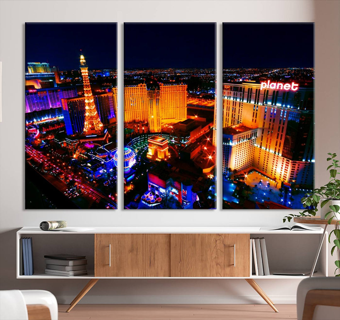 Las Vegas Wall Art Canvas Print showcases a dynamic and luminous cityscape at night with tall buildings and bustling streets. Expertly printed on museum-quality canvas, this gallery-wrapped artwork is enhanced with a UV-protective coating to ensure lasting brilliance.