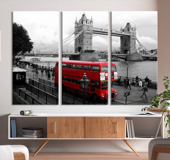 The London Red Bus and Bridge Wall Art Canvas Print showcases a red London bus in front of Tower Bridge, beautifully presented as a gallery-wrapped canvas. This striking image is divided into three panels, delivering a museum-quality display that's ready to hang.