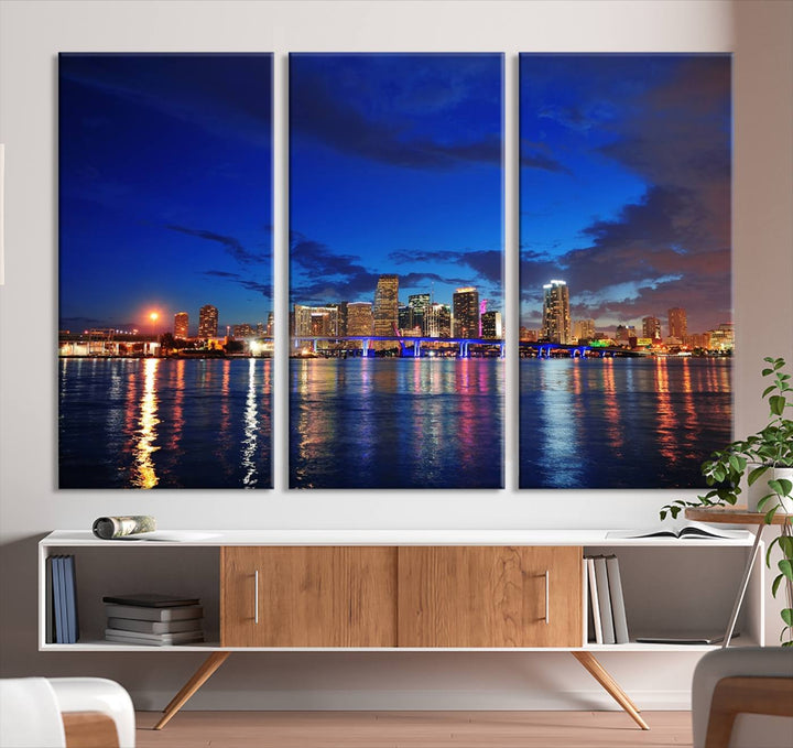 A large Miami City View Wall Art Canvas Print featuring the Miami City Skyline Panorama at night is displayed above the dresser.