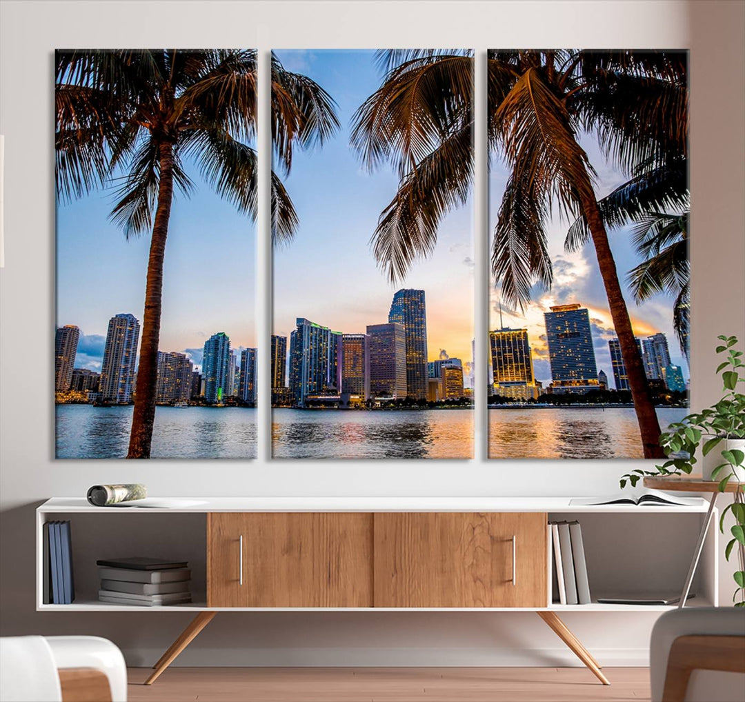 The Wall Art MIAMI Canvas Print features a triptych design depicting palm trees and a city skyline at sunset.