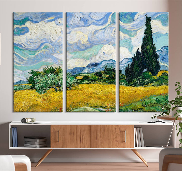 A contemporary living room features a large triptych of "Wheatfield With Cypresses By Van Gogh Painting Wall Art Canvas Print." Crafted on museum-quality canvas, this artwork brings a sense of elegance and craftsmanship reminiscent of professional artistry.