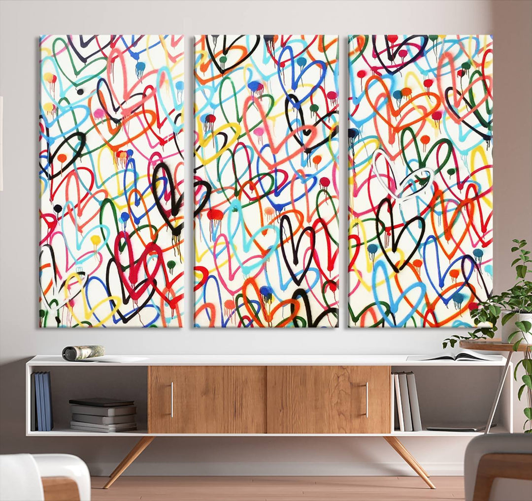 The "Colorful Love Canvas print," featuring vibrant abstract street art with overlapping loops, is handmade in the USA.