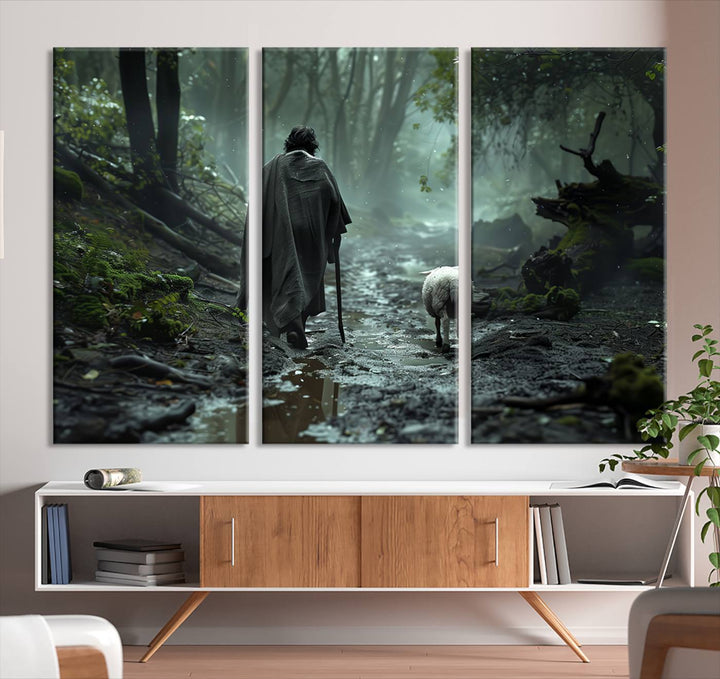 The "Forest Jesus Shepherd Canvas Wall Art" features a person with a cane, clothed in a cloak, walking beside a sheep through a misty forest. This piece captures tranquility and is ideal for adding serenity to your living room, office, or bedroom decor.