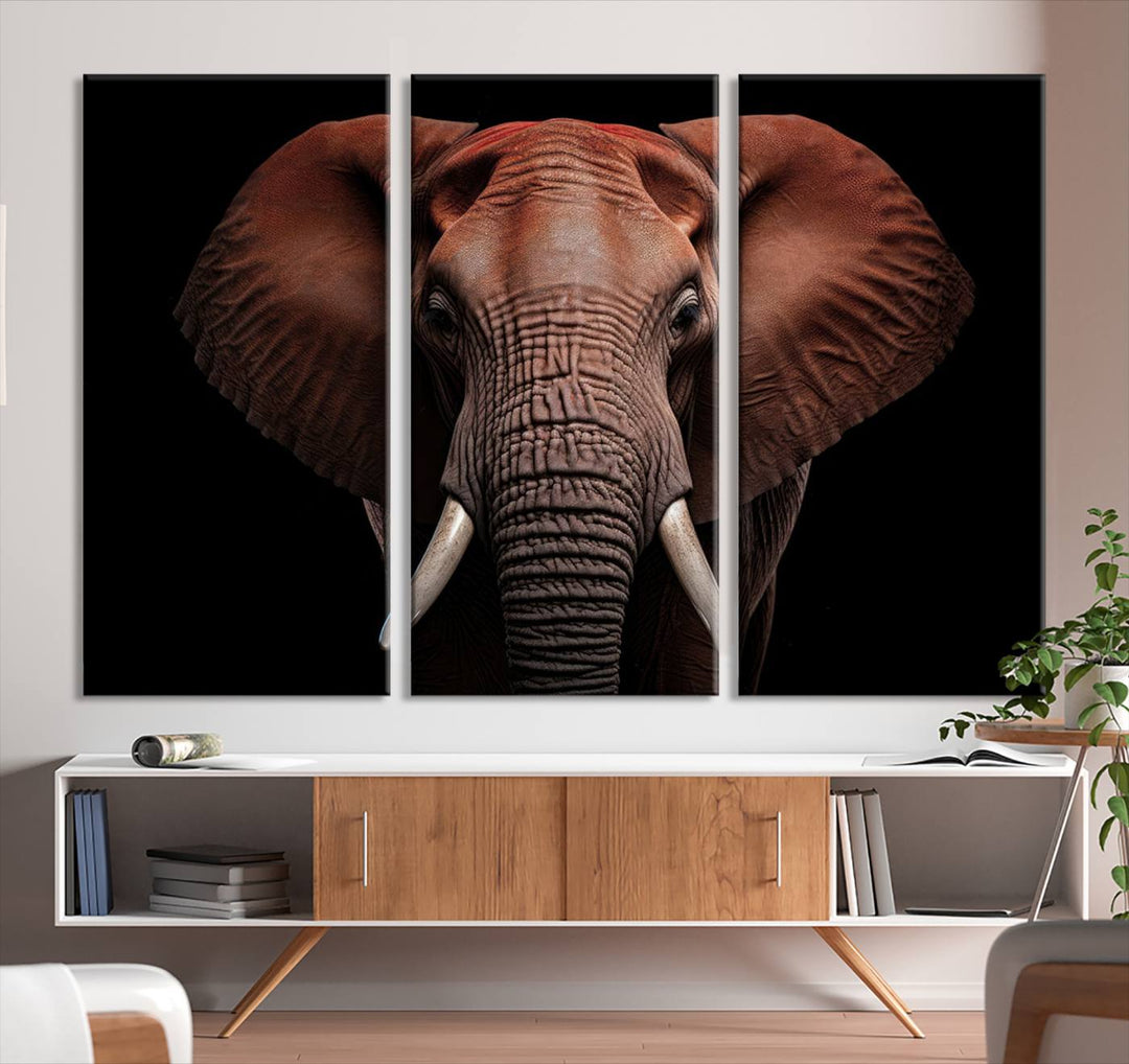 A stunning triptych titled "Wild Elephant Wall Art Canvas Print" beautifully enhances the wall above a contemporary living room. This Africa Savannah Wild Animal Wall Decor Print is of museum-quality, complete with a UV-protective coating to ensure its vibrancy and beauty are preserved for years.