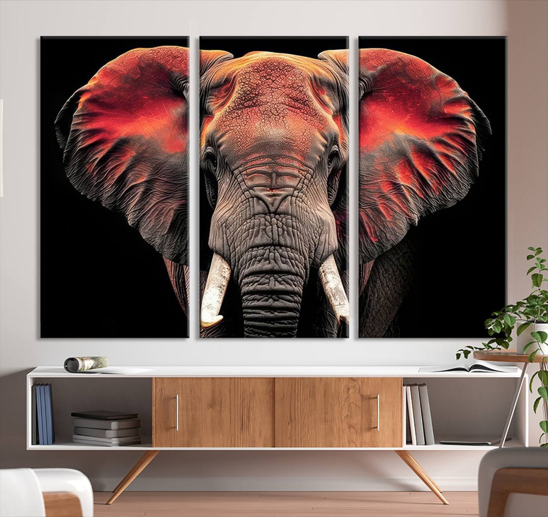 The Elephant Wall Art Canvas Print, featuring vibrant red and black tones, is a stunning artwork printed on museum-quality canvas. It comes with a UV-protective coating.