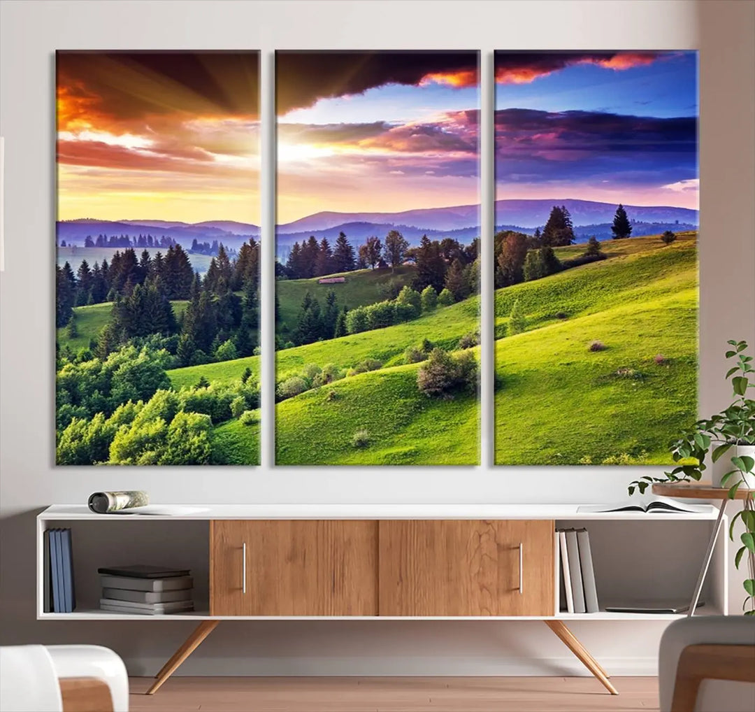 The room features a large triptych of the Green Hills and Sunset Wall Art Print, showcasing a scenic landscape with lush greenery and a vibrant sky.