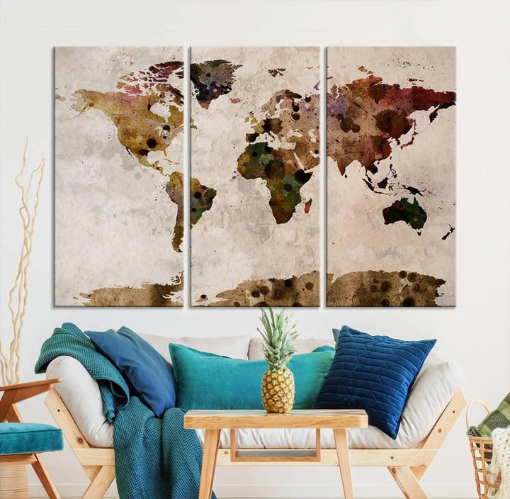 A Watercolor World Map Canvas Print, wrapped in an elegant gallery style, hangs on the wall.