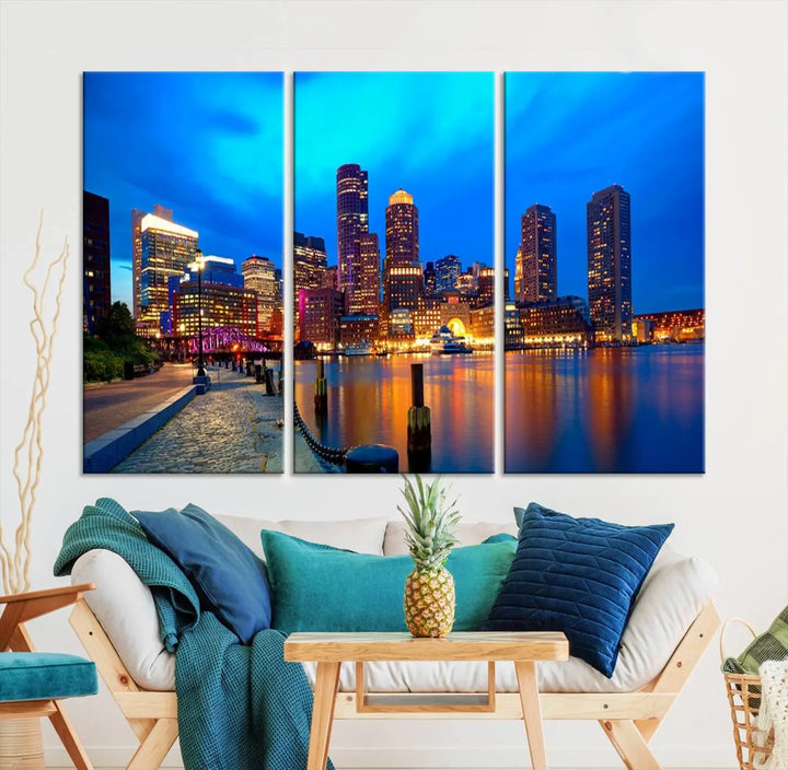 A triptych of the "Boston City Lights Night Blue Skyline Cityscape View Wall Art Canvas Print" adorns the wall. This museum-quality canvas artwork is ready to hang and includes a UV-protective coating for lasting brilliance.