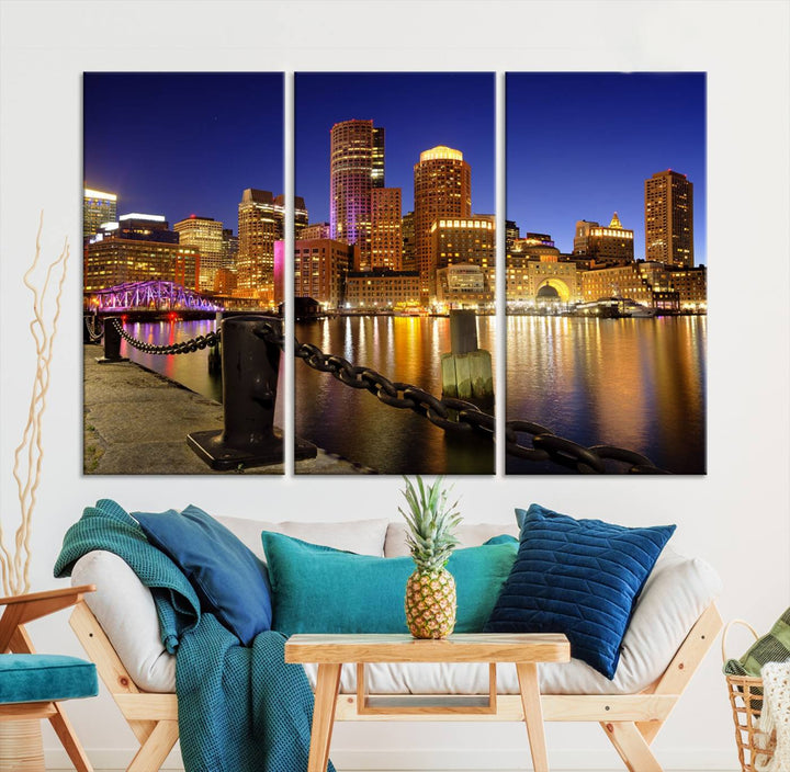 The "Boston City Night Skyline Cityscape View Wall Art Canvas Print" beautifully portrays a stunning triptych of a city skyline illuminated against the night sky, elegantly reflected in the river below. These museum-quality canvases are gallery wrapped to ensure an elegant presentation that enhances any space.