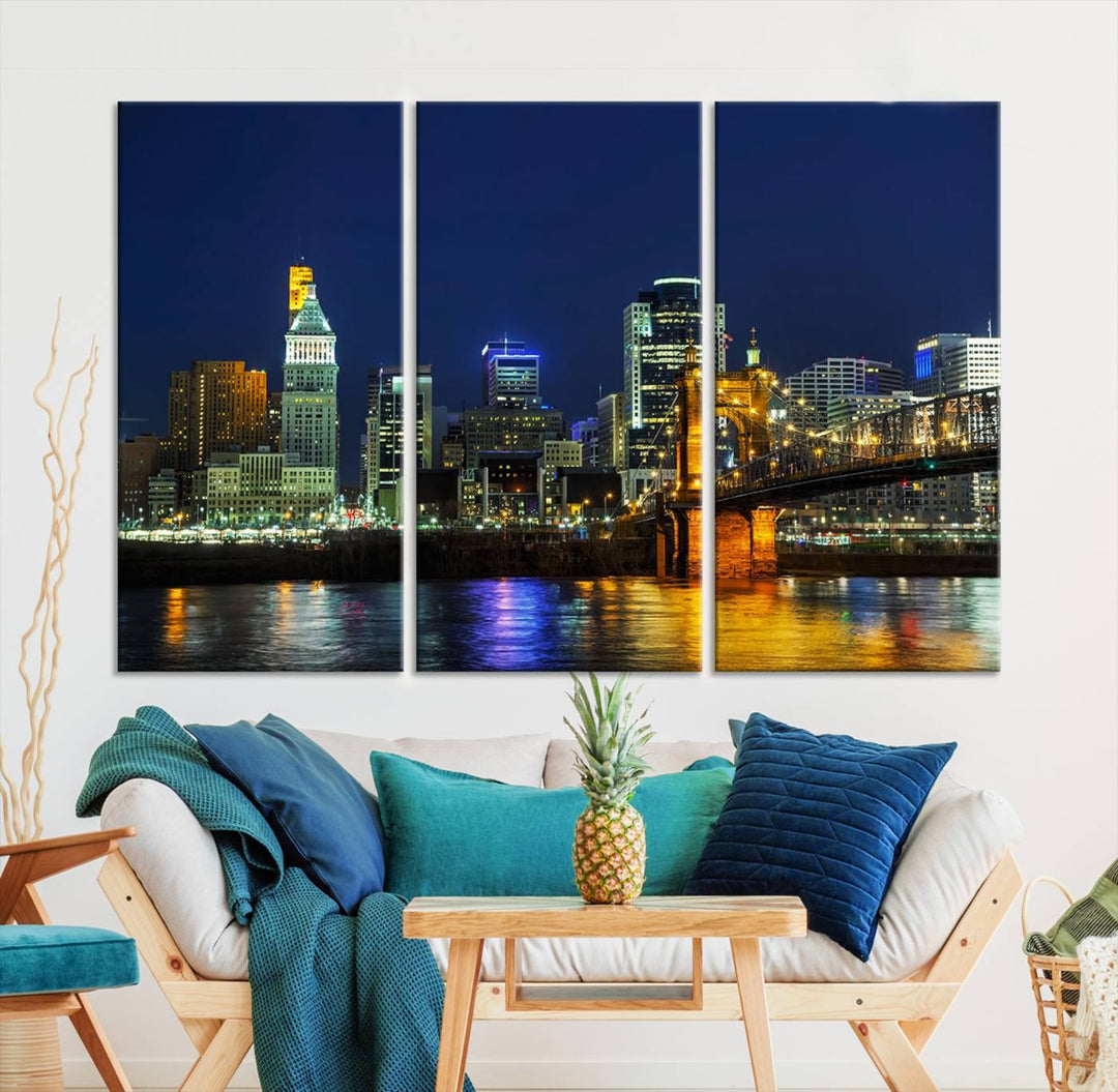 The "Cincinnati City Lights Night Skyline Cityscape" canvas print, displayed above a sofa, exhibits museum-quality craftsmanship with a UV-protective coating.