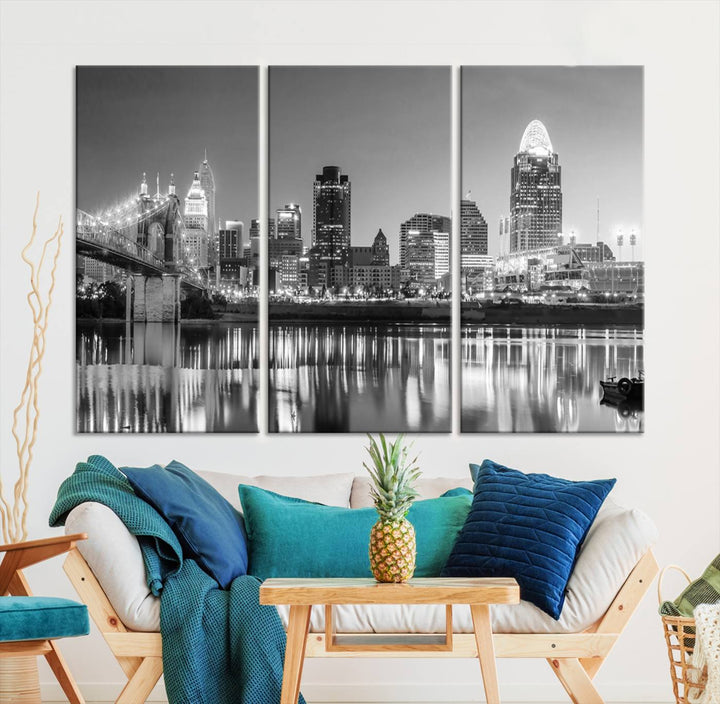 The "Cincinnati City Lights Skyline Black and White Wall Art Cityscape Canvas Print" is elegantly displayed in a stylish living room.