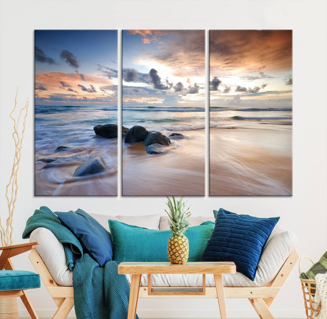 The "Serene Weather On The Beach Wall Art Canvas Print," featuring a tranquil beach scene with rocks and waves, is ready to hang and enjoy.