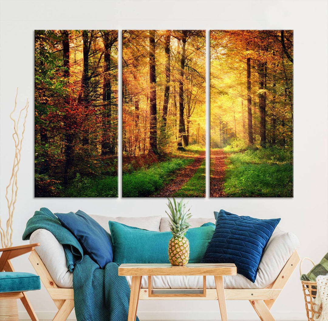 The Sunlight Through Trees Wall Art Canvas Print showcases a sunlit forest path in autumn on gallery-wrapped, museum-quality canvas with UV-protective coating.