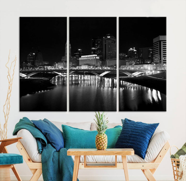 The living room features the "Columbus City Lights Skyline Black and White Wall Art Cityscape Canvas Print" above a coffee table. This artwork is presented as a triptych on museum-quality canvases with UV-protective coating.