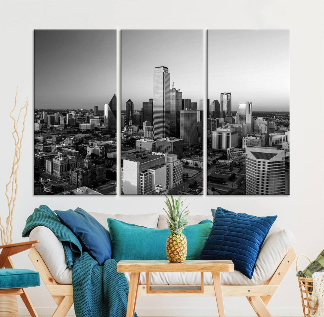 A modern living room showcases the Dallas City Lights Skyline Black and White Wall Art Cityscape Canvas Print. This gallery-wrapped piece offers a sleek finish and is crafted from museum-quality pollycotton. It features a UV-protective coating to ensure lasting vibrancy.