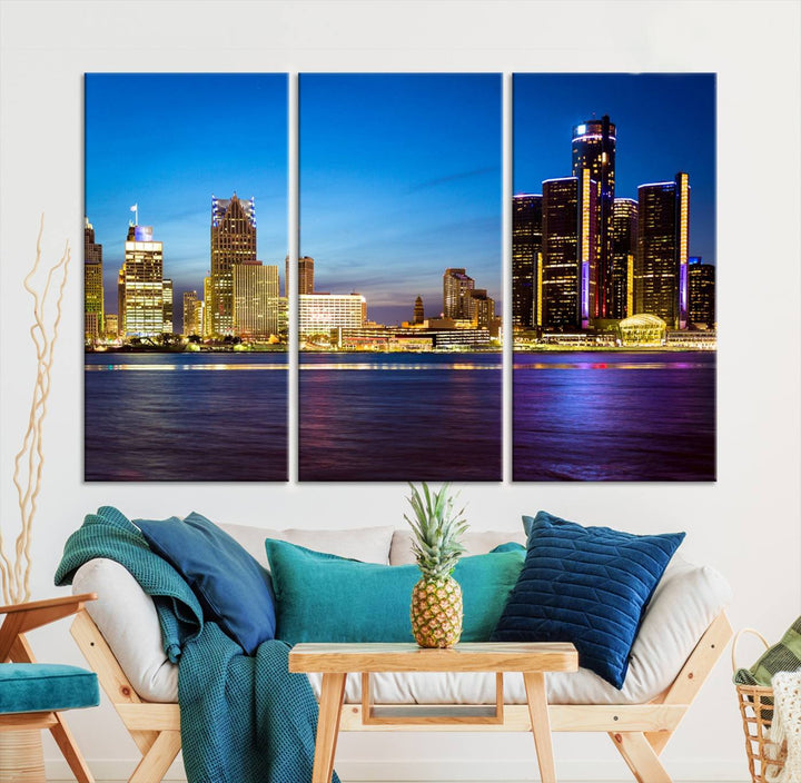 The living room features a breathtaking canvas print titled "Detroit City Lights Night Bright Blue Skyline Cityscape View," presented in a stunning triptych format on museum-quality canvases that are ready to hang.