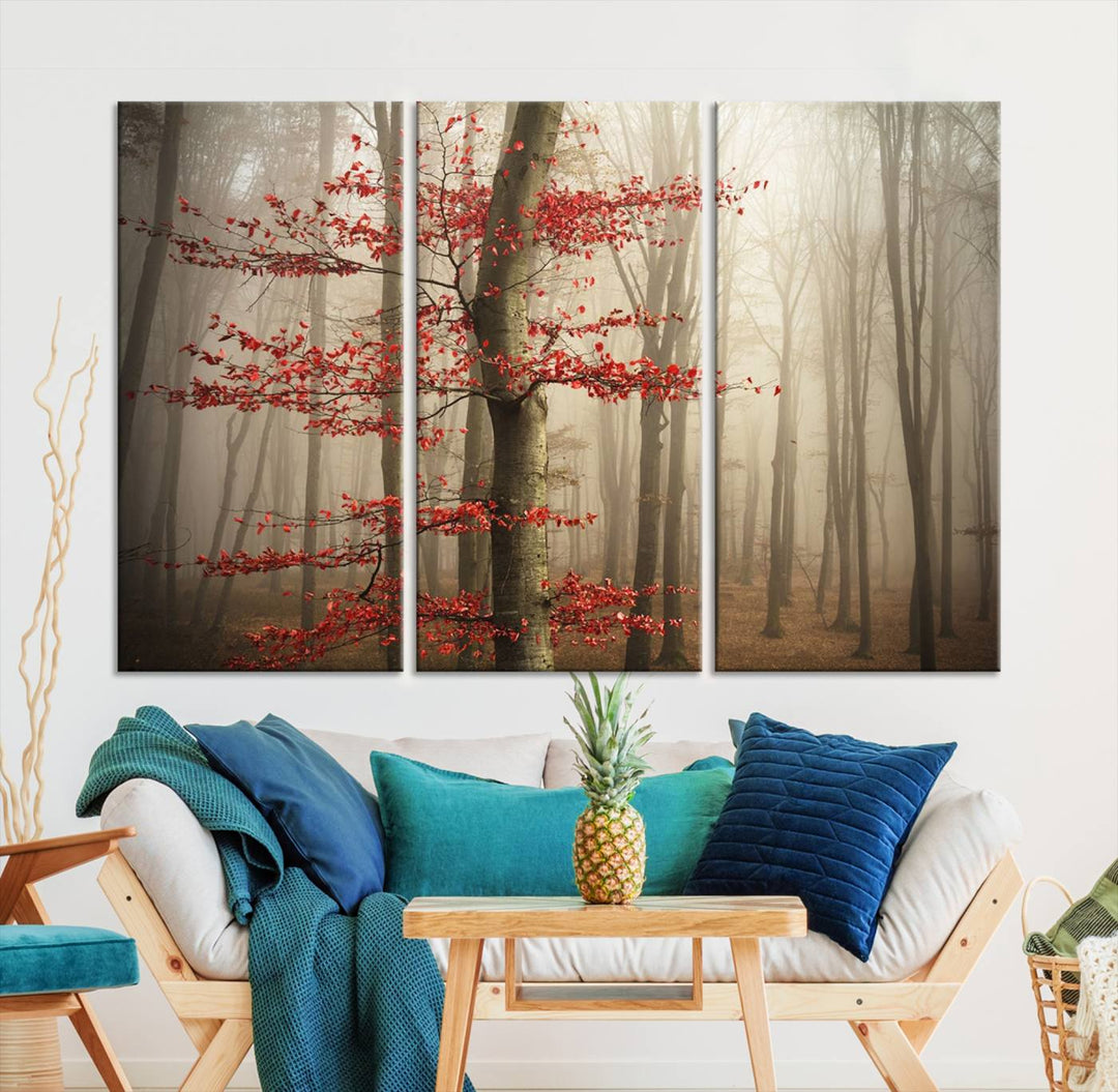 The living room features the Foggy Forest Wall Art, an Autumn Trees Canvas Print that showcases a serene nature scene with foggy woodland decor and a tree adorned in vibrant red leaves.