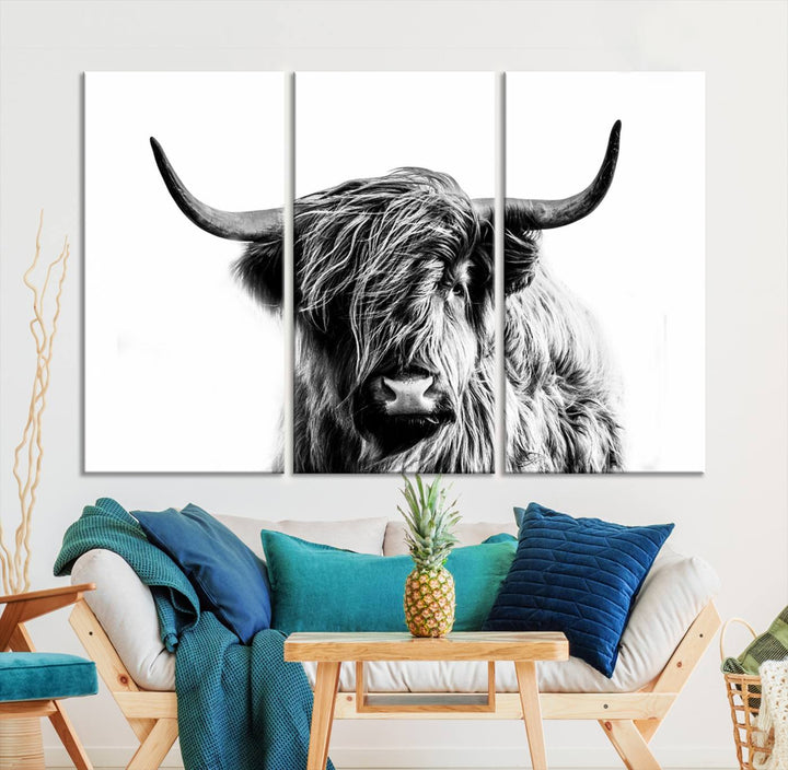 The Scottish Highland Cow Cattle Art Print Farmhouse Wall Art Canvas Print enhances rustic farmhouse decor with its depiction of a long-haired, large-horned cow. This triptych is an ideal choice for chic wall art.