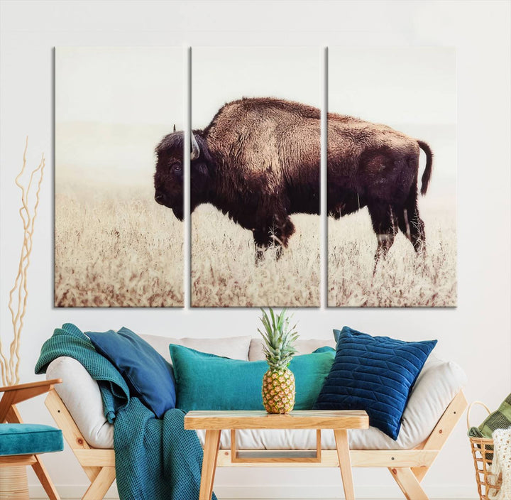 A stylish living room showcases the captivating "Bison in Field" Wall Art Canvas Print as farmhouse decor.