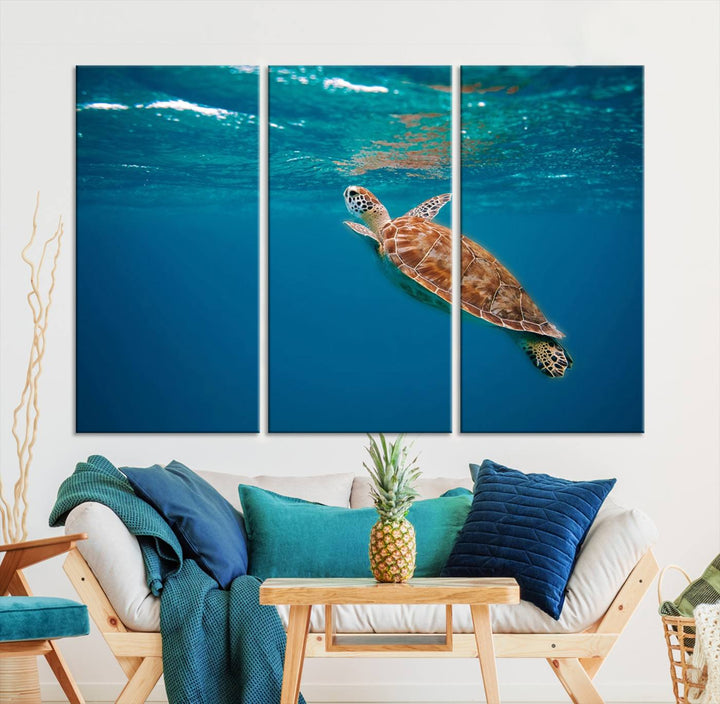 The living room features the "Baby Turtle in Ocean" wall art canvas print. This gallery-quality piece, depicting a sea turtle swimming underwater, adds an elegant touch to the space.