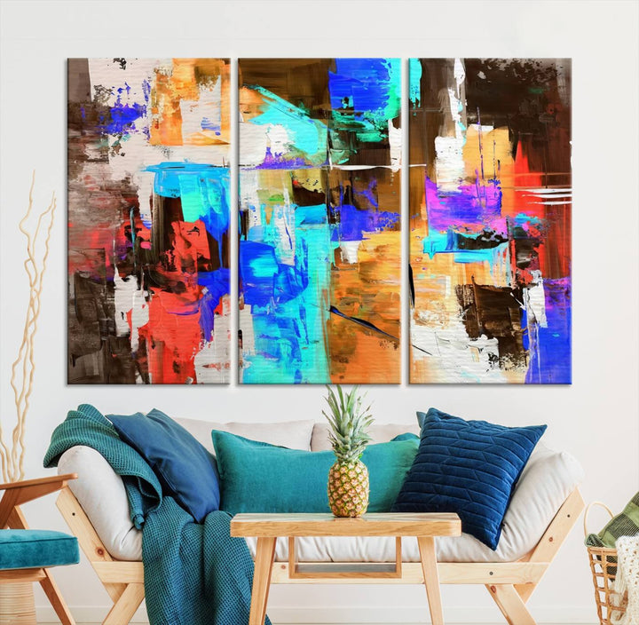 In a modern living room, the "Colorful Abstract Wall Art Canvas Print" serves as a stunning triptych centerpiece on museum-quality canvas, ready to hang. Its UV-protective coating ensures enduring vibrancy.