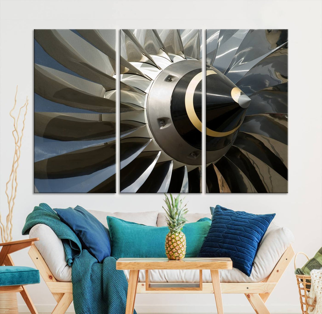 A contemporary living room showcases a Jet Motor Wall Art Canvas Print, creating a museum-quality triptych. The gallery-wrapped canvas lends an elegant touch to the space.