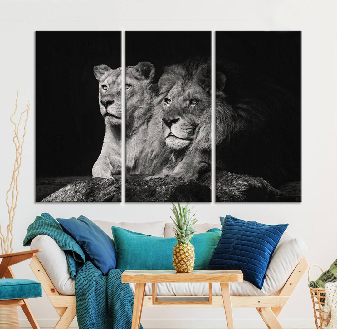 The elegant wildlife portrait, "Lion Couple Canvas Wall Art Print," featuring a black and white depiction of a lion family, majestically decorates the living room wall.