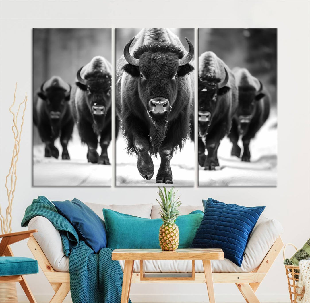 A modern living room features a striking black-and-white American Bison Art | Buffalo Herd Wall Art Canvas Print on the wall.