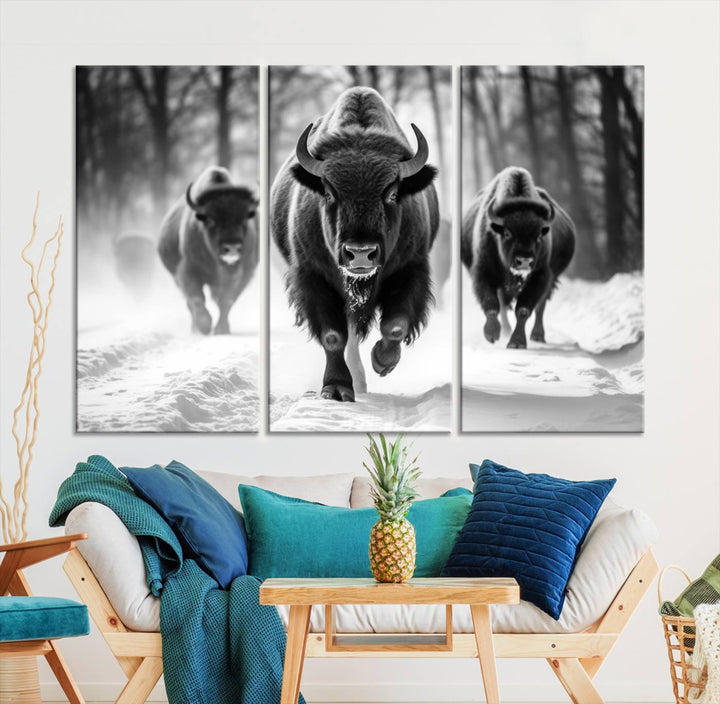 Transform your living room with the Buffalo Wall Art Canvas Print triptych, showcasing a bison family in motion across a snowy landscape. This striking Western decor piece becomes the focal point of any room.